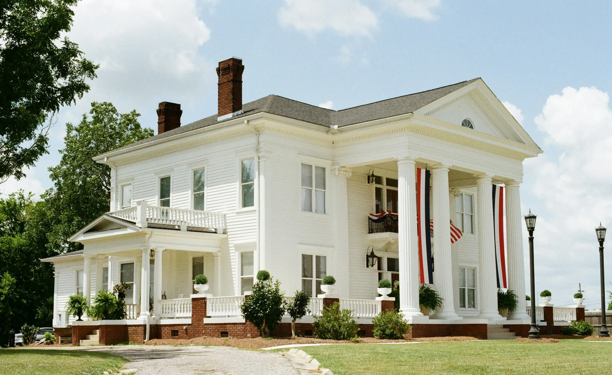 Large white colonial-style house with columns