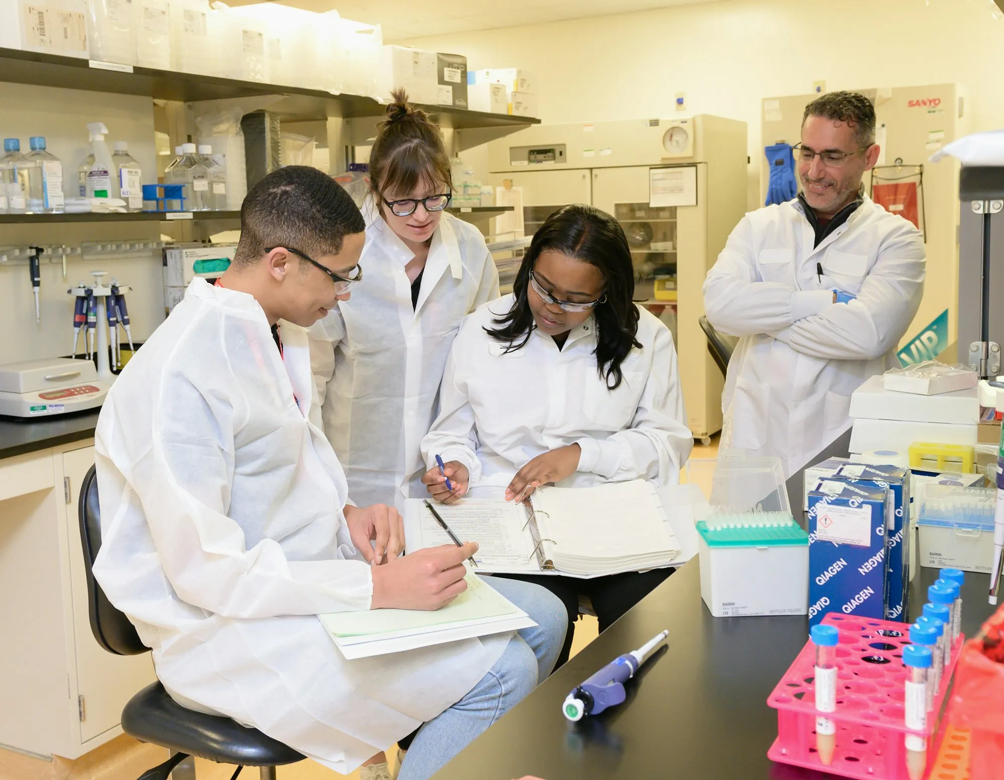 Team of lab analysts reviewing results